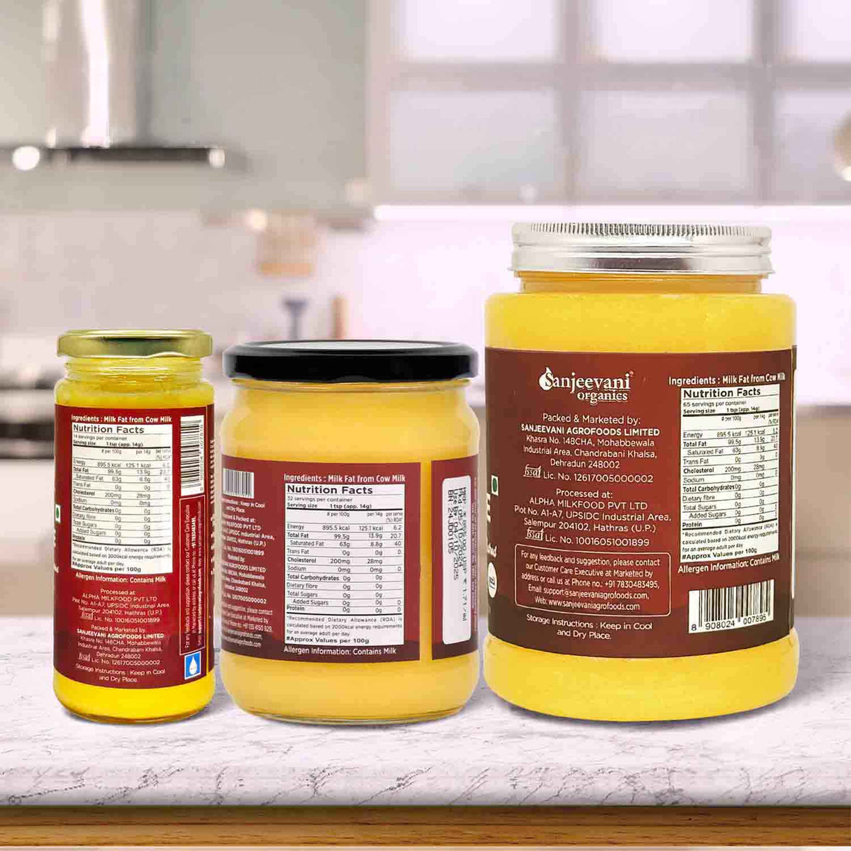 Barsana Magic and Three jars of Sanjeevani mustard on a kitchen counter with visible labels.