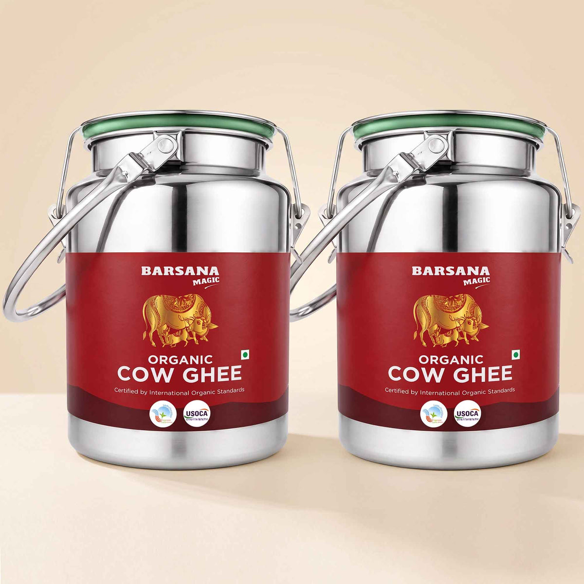 Barsana Magic and Two stainless steel jars of Barsana Organic Cow Ghee with red labels, shown side by side on a light beige background.