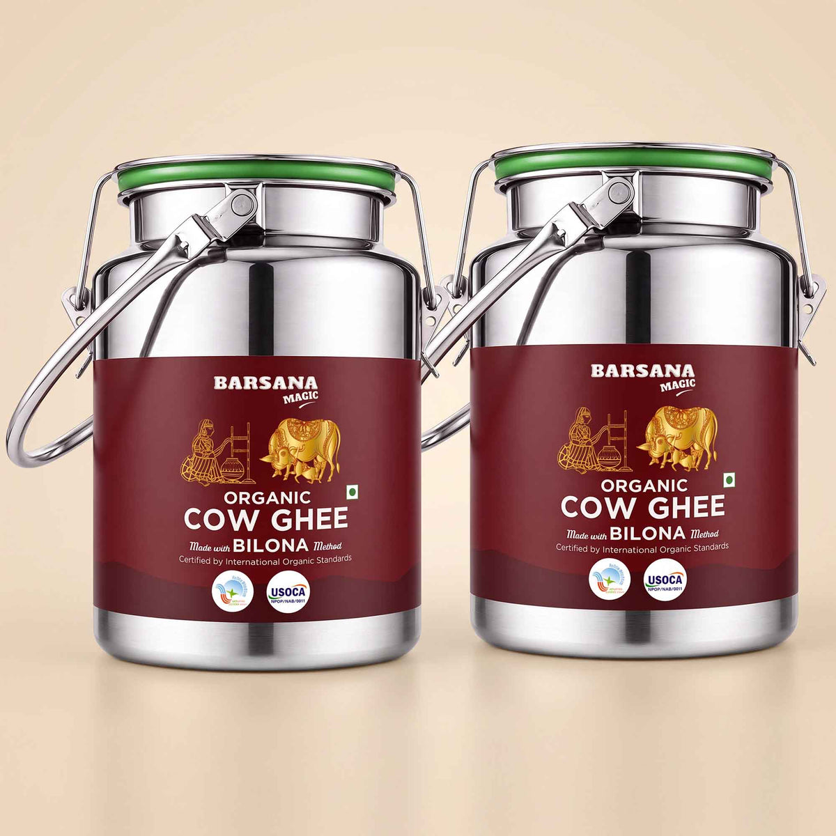 Barsana Magic and Two large stainless steel jars of Barsana Magic Organic Cow Ghee with Bilona flavor, shown side by side on a light beige background.