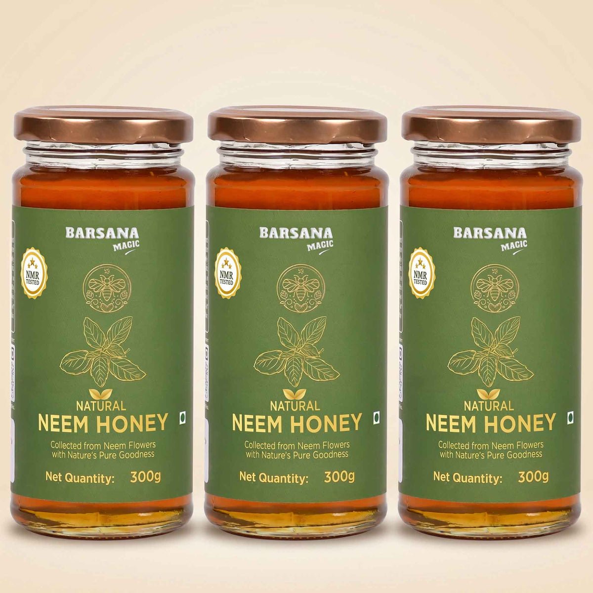 Barsana Magic and Three glass jars of Barsana Natural Neem Honey arranged side by side on a light beige background. Each jar has a dark green label with gold text and illustrations, topped with a metallic bronze lid.
