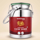 Barsana Magic and A stainless steel milk canister with a red label for Barsana Magic Organic Cow Ghee, set against a solid beige background.