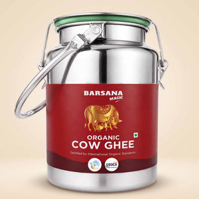 Barsana Magic and A stainless steel milk canister with a red label for Barsana Magic Organic Cow Ghee, set against a solid beige background.