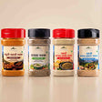 Barsana Magic and Four spice powder bottles from Himalaya Sansad Kosh displayed side-by-side on a light beige background. The bottles contain different spices (Masala Chogong, Shatavari Masala, Chana Masala, and Panchamrit Masala) and are equipped with red, black, red, and black caps respectively.