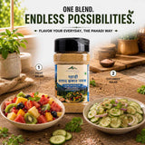 Barsana Magi and A jar of Pahalidhuna Salted Spinach Salt is displayed in a kitchen setting between two bowls of salad, with text overlays showing its use for fruit salad and cucumber salad.