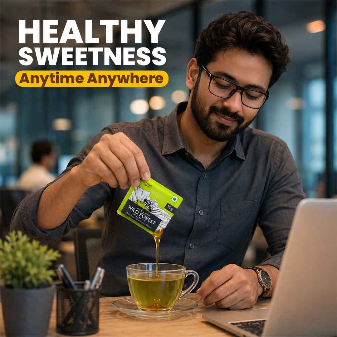 Barsana Magic and Man pouring tea from a packet into a cup with text 'Healthy Sweetness Anytime Anywhere' in a blurred office setting.