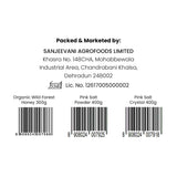 Barsana Magic and Label with Sanjeevani Agrofoods Limited information and barcodes for organic wild forest honey and pink salt products.