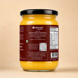 Barsana Magic and A 500ml glass jar of Sanjeevani Organics Sanjeever Organic Foods Global LLP Turmeric Powder, showing the back label against a solid beige background.