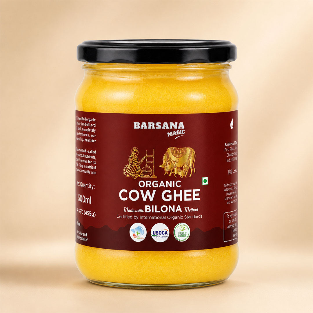 Barsana Magic and A jar of Barsana Magic Organic Cow Ghee, 300ml, featuring a dark red label with gold illustrations of a cow and a person, and a black lid, set against a warm beige background.