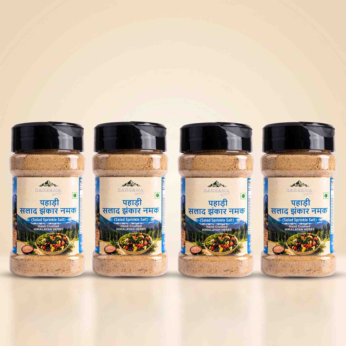 Barsana Magic and Four jars of Barsega Lahadi Saltaad Bhashkar Namak (Chile Pepper Salt) arranged in a row against a light beige background.