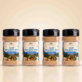 Barsana Magic and Four jars of Barsega Lahadi Saltaad Bhashkar Namak (Chile Pepper Salt) arranged in a row against a light beige background.