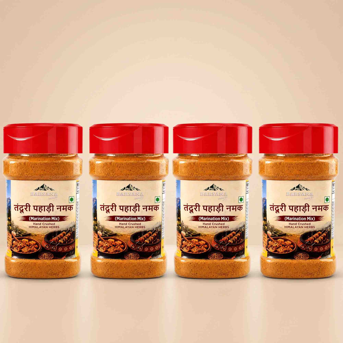 Barsana Magic and Four jars of Tendu Priya Pahari Namak (Distillation Mix) Indian Red Chilli Salt arranged in a row on a light beige background.