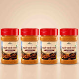 Barsana Magic and Four jars of Tendu Priya Pahari Namak (Distillation Mix) Indian Red Chilli Salt arranged in a row on a light beige background.