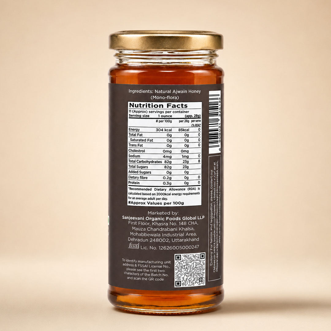 Barsana Magic and A glass jar of honey with a gold metal lid and a dark brown label showing the Nutrition Facts panel, photographed against a solid beige background.