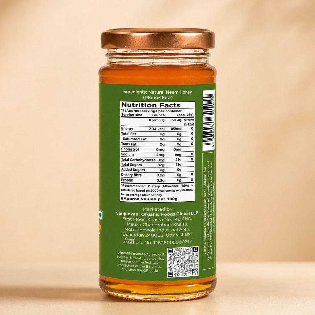 Barsana Magic and A glass jar of natural neem honey with a copper-colored metal lid and a green label showing the nutrition facts panel, set against a warm beige background.