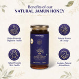 Barsana Magic and A jar of Barsana Mantri Natural Jamun Honey centered on a cream-colored background with decorative leaf borders and text highlighting health benefits. Four circular icons around the jar describe digestive, energy, skin, and antioxidant benefits.