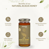 Barsana Magic and A 300g glass jar of Barsana Natural Acacia Honey centered on a light cream background with decorative leaves and text highlighting benefits such as sustainable harvesting, antioxidant properties, skin wellness, and digestive support.