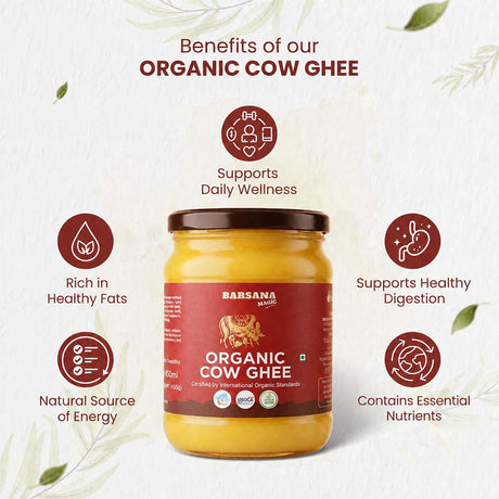 Barsana Magic and A jar of Barsana Organic Cow Ghee centered on a light textured background with decorative leaves and informational callouts about its benefits, including rich in healthy fats, supports daily wellness, supports healthy digestion, natural source of energy, and contains essential nutrients.