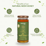 Barsana Magic and A 300g glass jar of Barsana Natural Neem Honey centered on a light cream background, surrounded by green decorative leaves and text highlighting health benefits: supports natural antioxidant levels, promotes digestive health, supports immune function, and supports detoxification and skin purification.