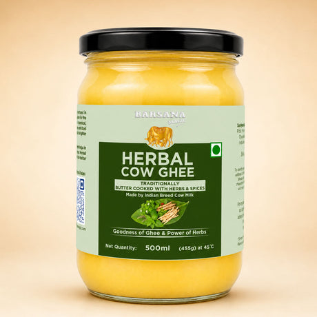 Barsana Magic and A 500ml glass jar of Bansana Herbal Cow Ghee with a black lid and a light green and dark green label, set against a solid beige background.