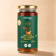Barsana Magic and A 300g glass jar of Barsana Magic Organic Wild Forest Honey with a gold lid and a dark green label, set against a solid beige background.