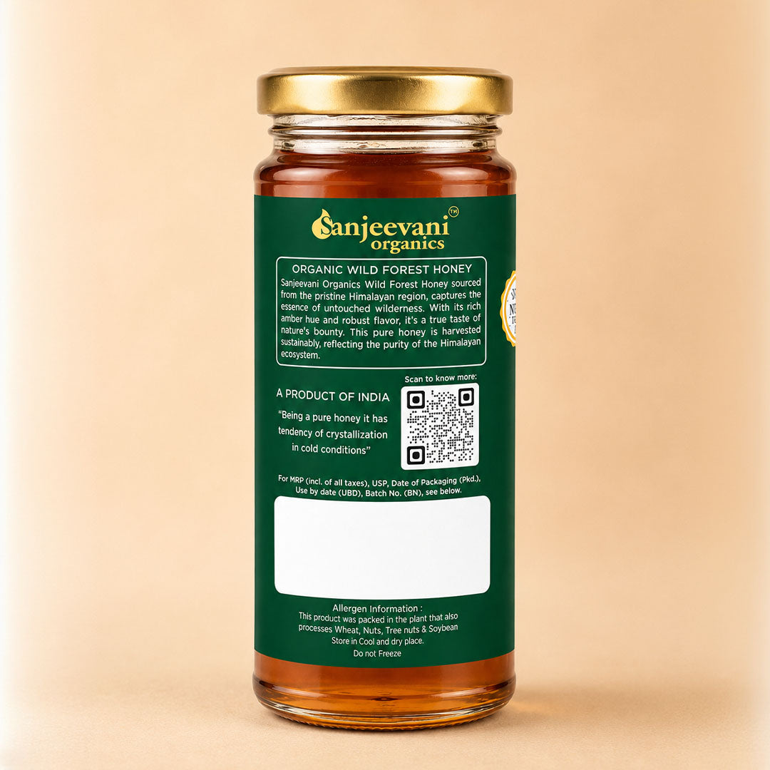 Barsana Magic and A glass jar of Sanjeevani Organics Organic Wild Forest Honey with a gold screw cap and a dark green label, set against a solid beige background.