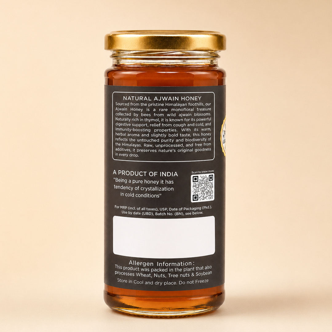 Barsana Magic and A glass jar of Natural A JWain Honey with a gold metal lid and a black label showing product details, set against a solid beige background.