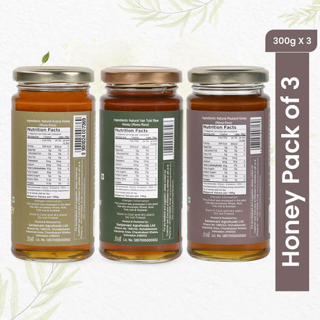 Trio of 100% natural honey jars in Acacia, Mustard, and Van Tulsi flavors, showcasing golden hues and pure, unpasteurized goodness.