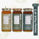 Three jars of natural honey, including bold Wild Forest, aromatic Van Tulsi, and smooth Acacia, in a vibrant pack of 3.