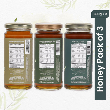 Three jars of natural honey, including bold Wild Forest, aromatic Van Tulsi, and smooth Acacia, in a vibrant pack of 3.