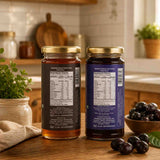 Barsana Magic and Two jars of honey with labels on a kitchen counter