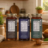 Barsana Magic and Three jars of honey with labels on a kitchen counter