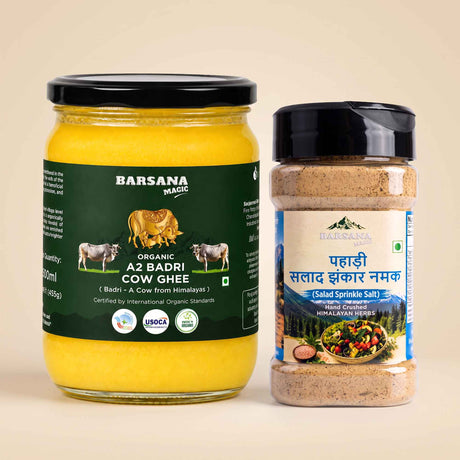 Barsana Magic and A jar of Barsana Magic Organic Az Badri Cow Ghee next to a shaker bottle of Barsana Magic Saladinkle Salt, both on a light beige background.