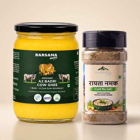 Barsana Magic and A jar of Barsana Organic Az Badri Cow Ghee and a shaker bottle of Barsana Rayyata Namak (Curd Mix Salt) displayed side-by-side on a light beige background.