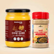 Barsana Magic and A jar of Barsana Magic Organic Cow Ghee and a plastic shaker of the same brand's Patli and Bilona (Spicy and Savory) spice mix, displayed side-by-side on a light beige background.