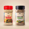 Barsana Magic and Two jars of Barmenara Maje spices on a light beige background: a red-capped Hand Crumbled Himalayan Salt jar on the left and a black-capped Hand Countered Himalayan Herbs jar on the right.