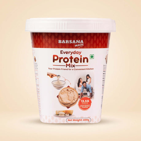 Barsana Magic and A 400g tub of Barsana Magic Everyday Protein Mix on a light beige background. The packaging features a white lid and base, with a red patterned top band and a white center label displaying the product name and usage imagery.