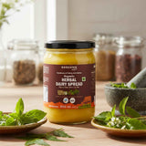 Barsana Magic and Jar of Organic Herbal Dairy Spread on a wooden surface with herbs around