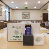 Barsana Magic and Honey jar on a stand with Sanjeevani Organics packaging in a room setting