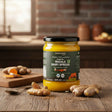 Barsana Magic and Jar of Ghee Masala Dairy Spread on a wooden surface with spices in the background