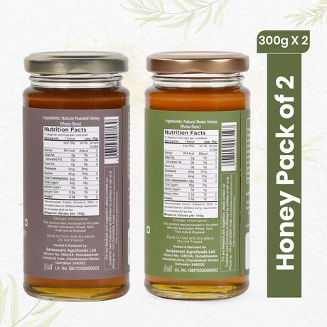 Two jars of 100% Natural Mustard Honey and Neem Honey side by side, showcasing their rich, golden and amber hues.