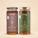 Barsana Magic and Two glass jars of Barsana Magic honey on a warm beige background. The left jar is labeled 'Natural Mustard Honey' with a dark purple label and a silver lid.