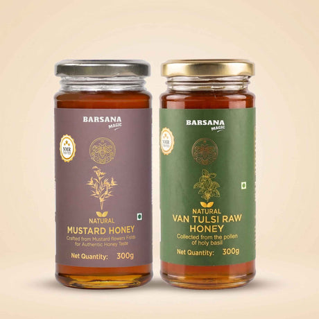 Barsana Magic and Two glass jars of Barsana Magic honey on a warm beige background. The left jar is labeled 'Natural Mustard Honey' with a dark purple label and a silver lid.
