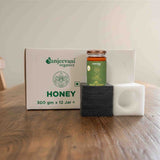 Barsana Magic and Jar of honey with a box labeled 'Sanjeevani Organics' on a wooden surface.