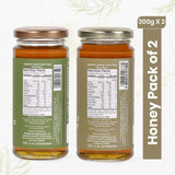 Pure Neem and Acacia Honey duo from Sanjeevani Organics, showcasing two golden jars of natural, chemical-free sweetness.