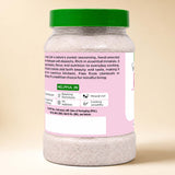 Barsana Magic and A plastic bottle of Himalayan salt with a green lid and a pink label, shown against a plain beige background.