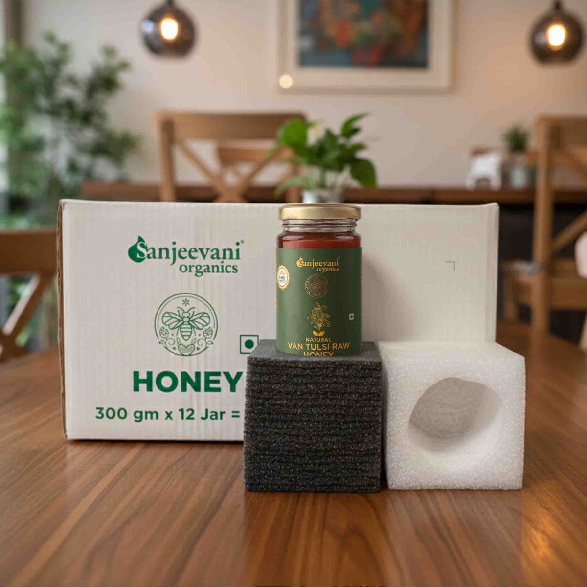 Barsana Magic and Jar of Sanjeevani honey on a wooden table with packaging in the background