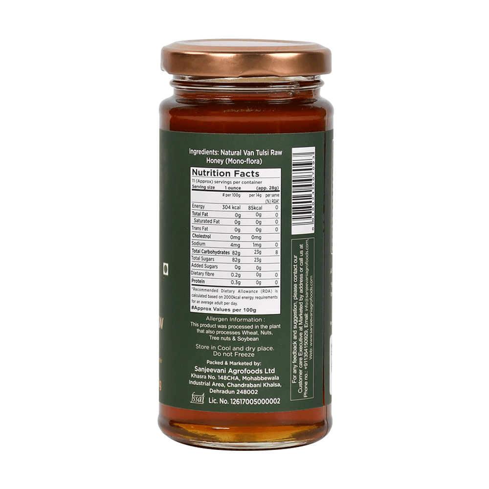 Pure Natural VanTulsi Raw Honey in a glass jar, showcasing its golden hue and rich, velvety texture from Van Tulsi nectar.