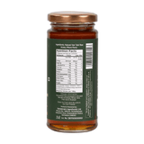 Pure Natural VanTulsi Raw Honey in a glass jar, showcasing its golden hue and rich, velvety texture from Van Tulsi nectar.