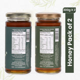 Two jars of Sanjeevani Organics Honey Combo Pack, featuring golden Organic Wild Forest Honey and aromatic Van Tulsi Honey.